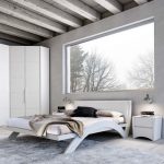 Нестандартная спальня выполненная в белом цвете