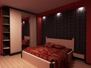 Интерьер небольшой спальни в красном колере